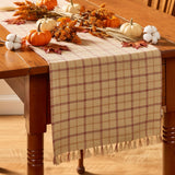 Simmons plaid table runner styled with fall centerpiece on farmhouse dining table

