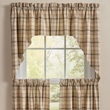 Toffee & Elm Plaid Swags, styled on a window against a neutral beige wall.