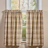 Toffee & Elm Plaid Cafe Tiers two tier panels in a beige green and brown plaid pattern, shown hanging on a white window frame against a beige wall.