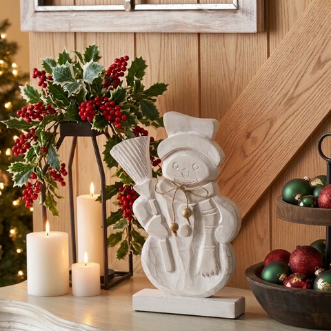 Snowman display with a natural wood wall