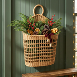 Brinkley Rattan Wall Pocket Basket in a woodland Christmas setting