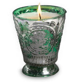 Fleur de Lys Green Tumbler Hand-Poured Soy Scented Candle in a decorative green-tinted glass holder with a flared base and embossed floral pattern, shown on a plain white background.