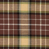 Close-up of Friar Brown Plaid Table Runner on a wooden table brown and green plaid fabric pattern