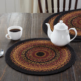 Heirloom Farm Braided Trivet 15" Set of 3 styled on dark farmhouse wood dining table with white teapot and coffee cup