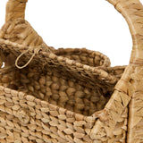 Close-up of water hyacinth weave and interior compartment detail on Cinthia Wine Basket Caddy, showing handcrafted natural fiber texture and sturdy construction