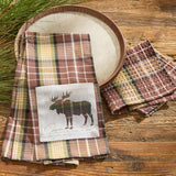 Friar Brown Plaid Moose Dishtowel on a wooden surface