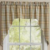 Sage & Mustard Plaid Swags curtains hnaging on a window and a view of trees outside