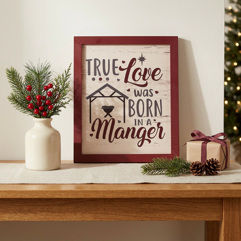True Love Was Born In A Manger Framed Sign in a Christmas console-table setting