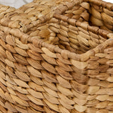 Close-up of Cinthia water hyacinth desk organizer showing woven texture and three slot compartments
