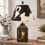Black lantern lamp with Holstein shade in farmhouse setting