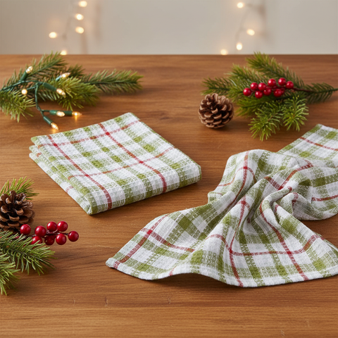 Snowman Plaid Waffle Dishtowels, set of 2, on a Christmas wood table